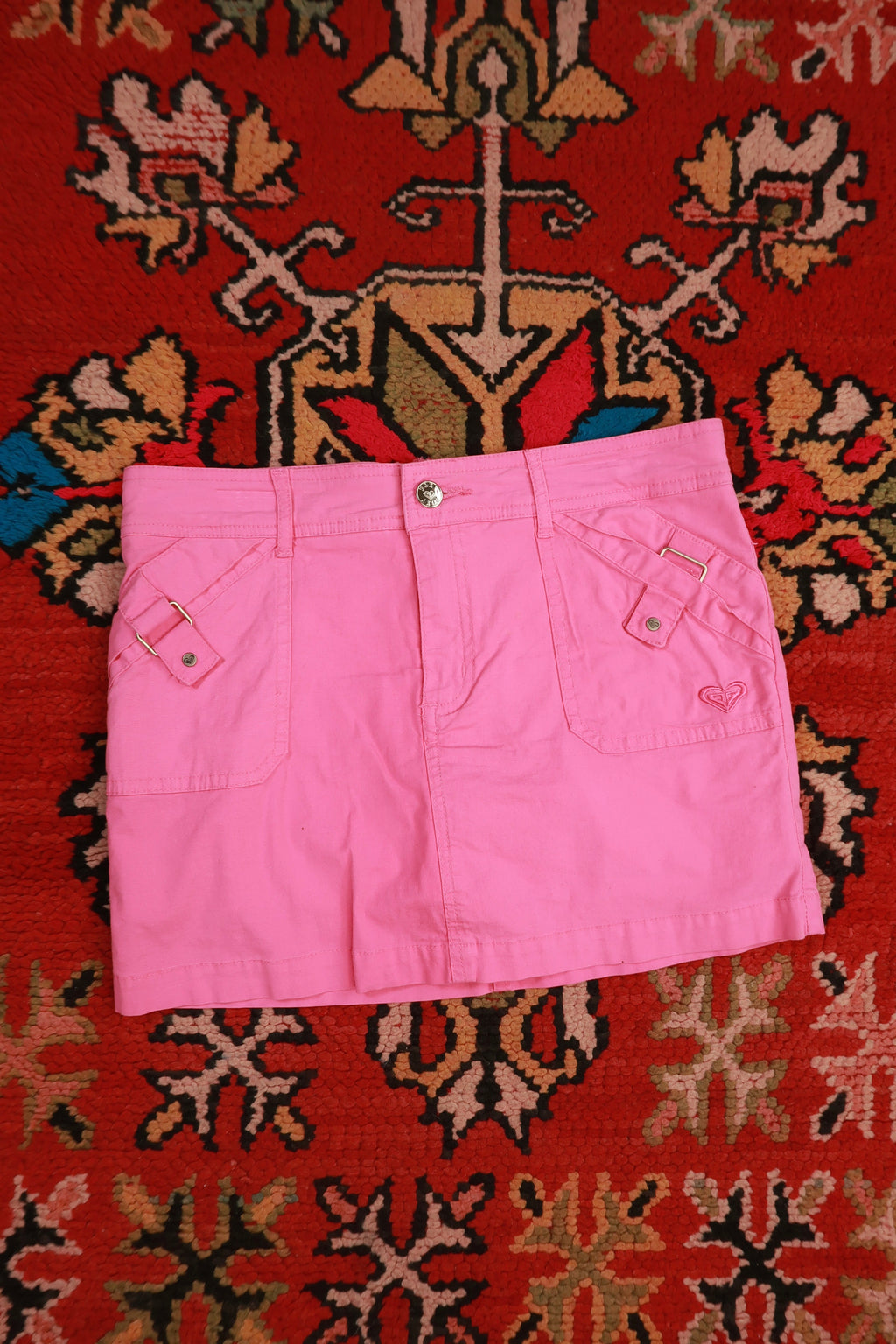 Vintage 2000s Roxy Girl pink skort mini skirt with built-in shorts, styled with casual detailing, by Elektra Vintage.