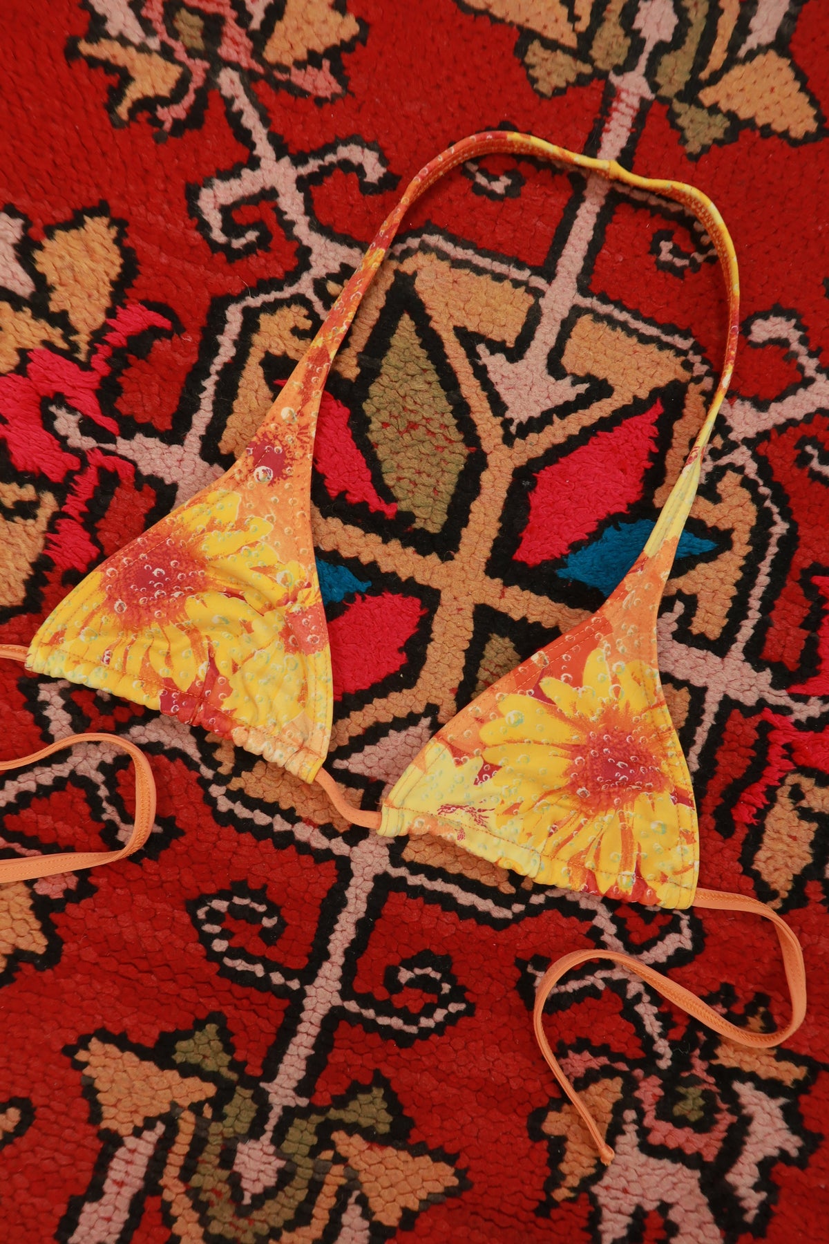 Vintage 2000s Brazilian sunflower print triangle bikini top by Elektra Vintage, featuring bright yellow sunflower patterns on lightweight fabric.