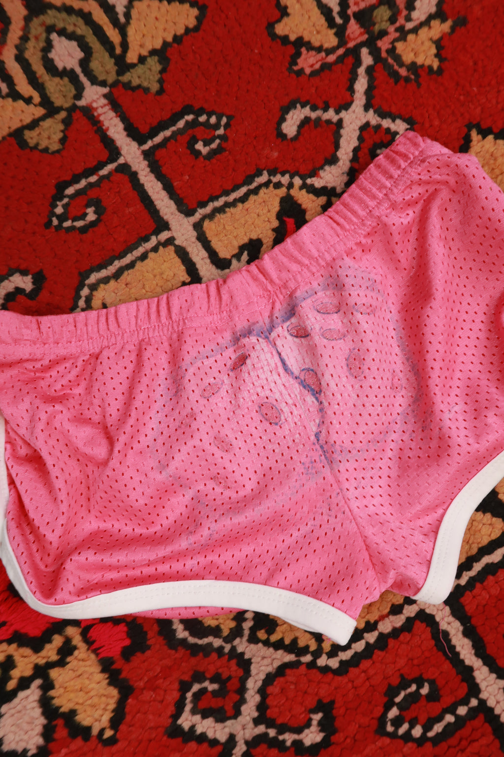 Pink vintage 2000s dice airbrush booty shorts for women by Elektra Vintage, featuring bold retro design and fitted style.