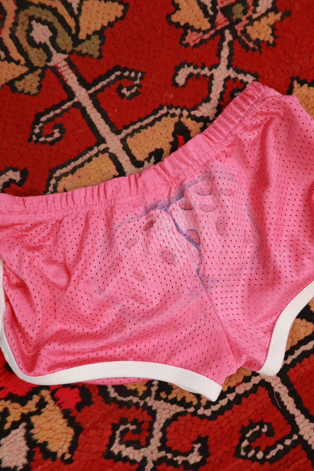 Pink vintage 2000s dice airbrush booty shorts for women by Elektra Vintage, featuring bold retro design and fitted style.