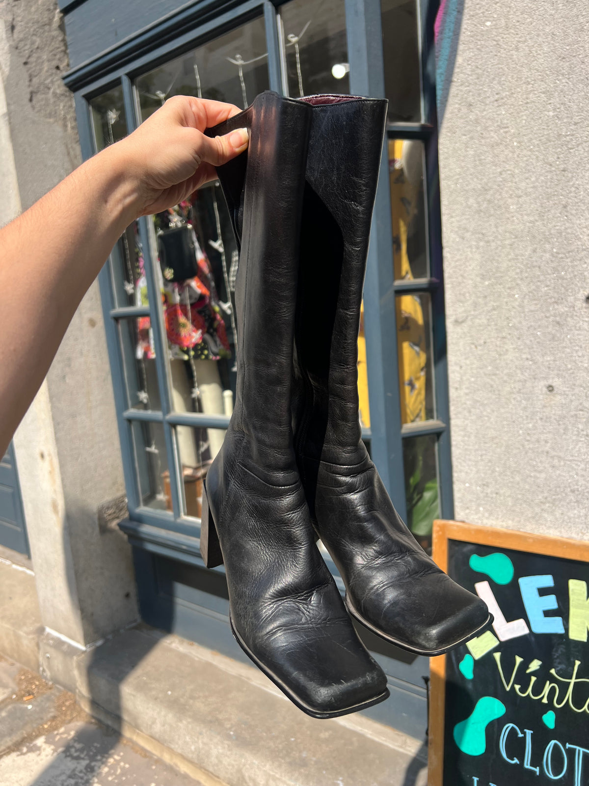 Vintage black leather mid-calf boots by Elektra Vintage, size 6, featuring classic design and sturdy mid-heel silhouette.