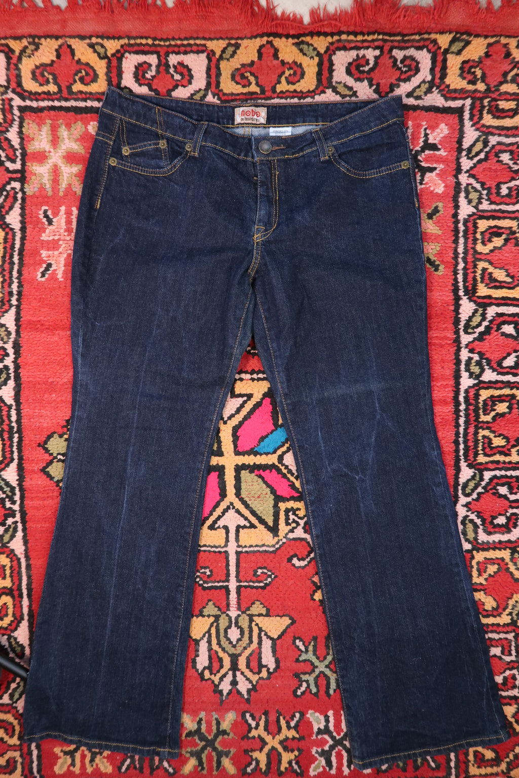 Vintage 2000s No Boundaries embroidered dark wash women's jeans with floral embroidery and classic five-pocket style.