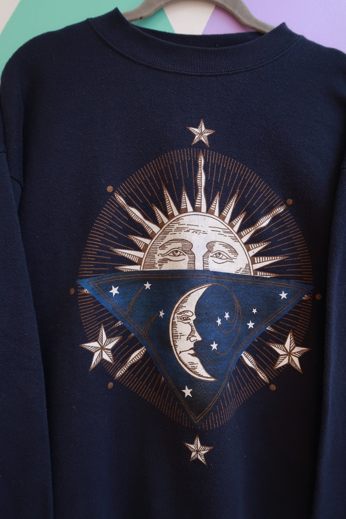 Navy blue vintage 90s Elektra Vintage crewneck sweatshirt with celestial sun and moon graphic design.