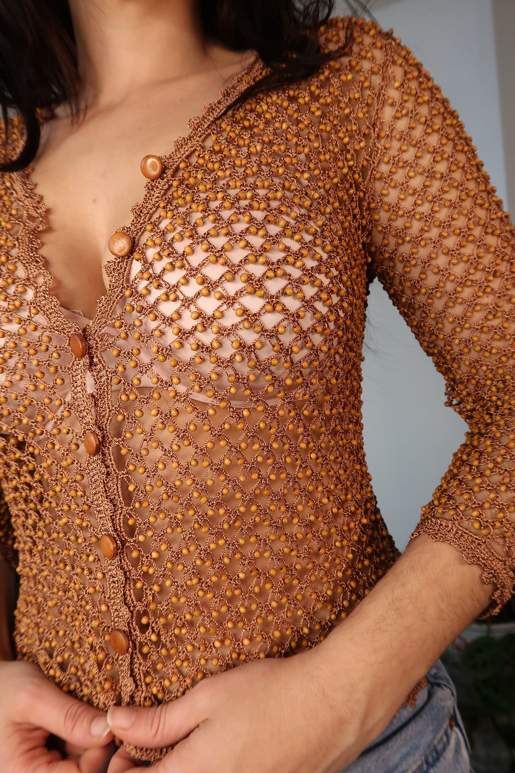 Elektra Vintage women's vintage beaded mesh button-up top with intricate beadwork and sheer fabric for a stylish retro look.