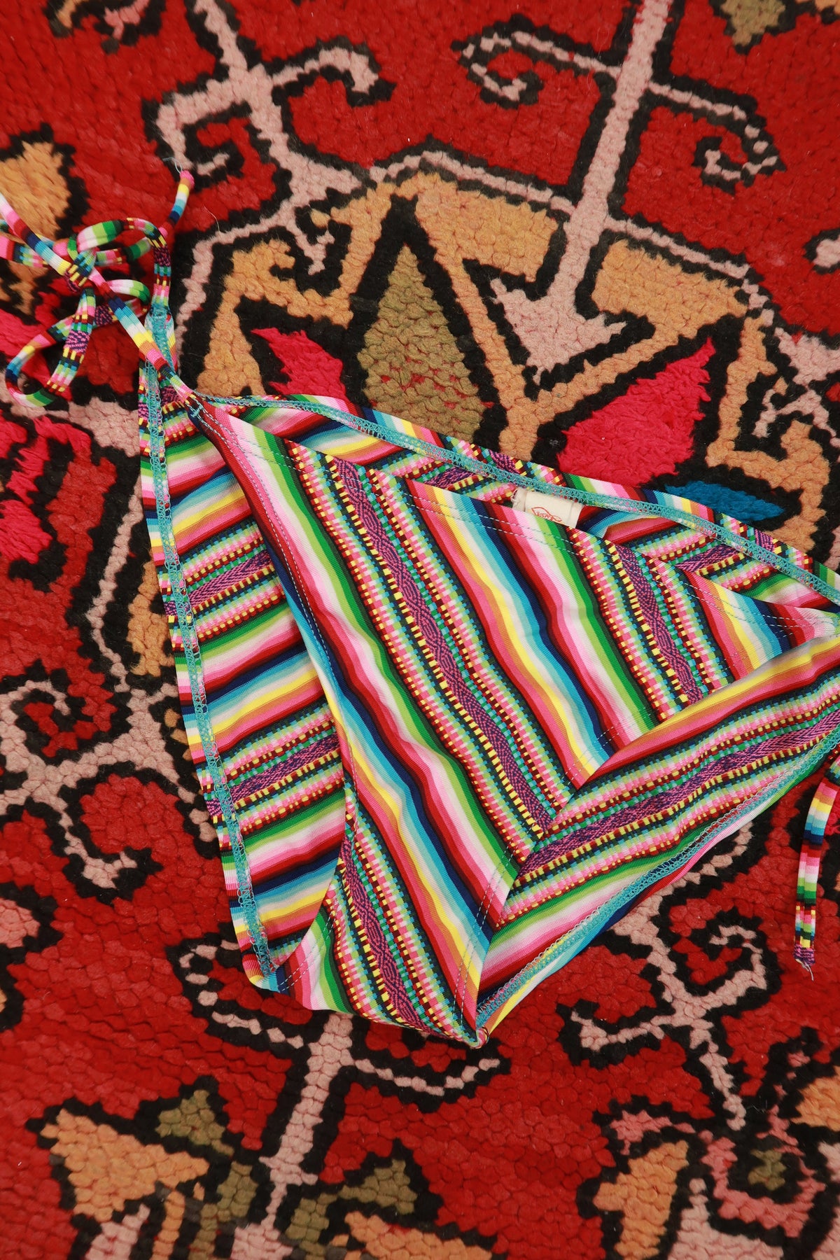 Elektra Vintage women's Y2K rainbow stripe tie-side bikini bottoms with retro style and colorful striped pattern.