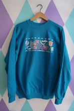 Load image into Gallery viewer, Vintage 90s Pike Place Market Seattle crewneck by Elektra Vintage featuring bright teal color with fruit and fish graphic design.
