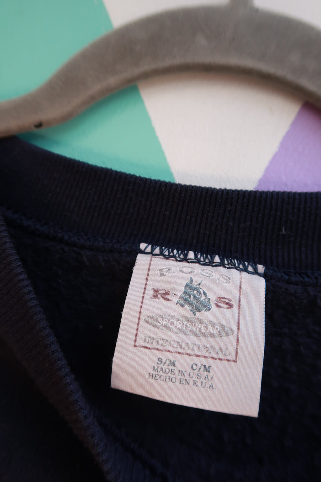Navy blue vintage 90s Elektra Vintage crewneck sweatshirt with celestial sun and moon graphic design.