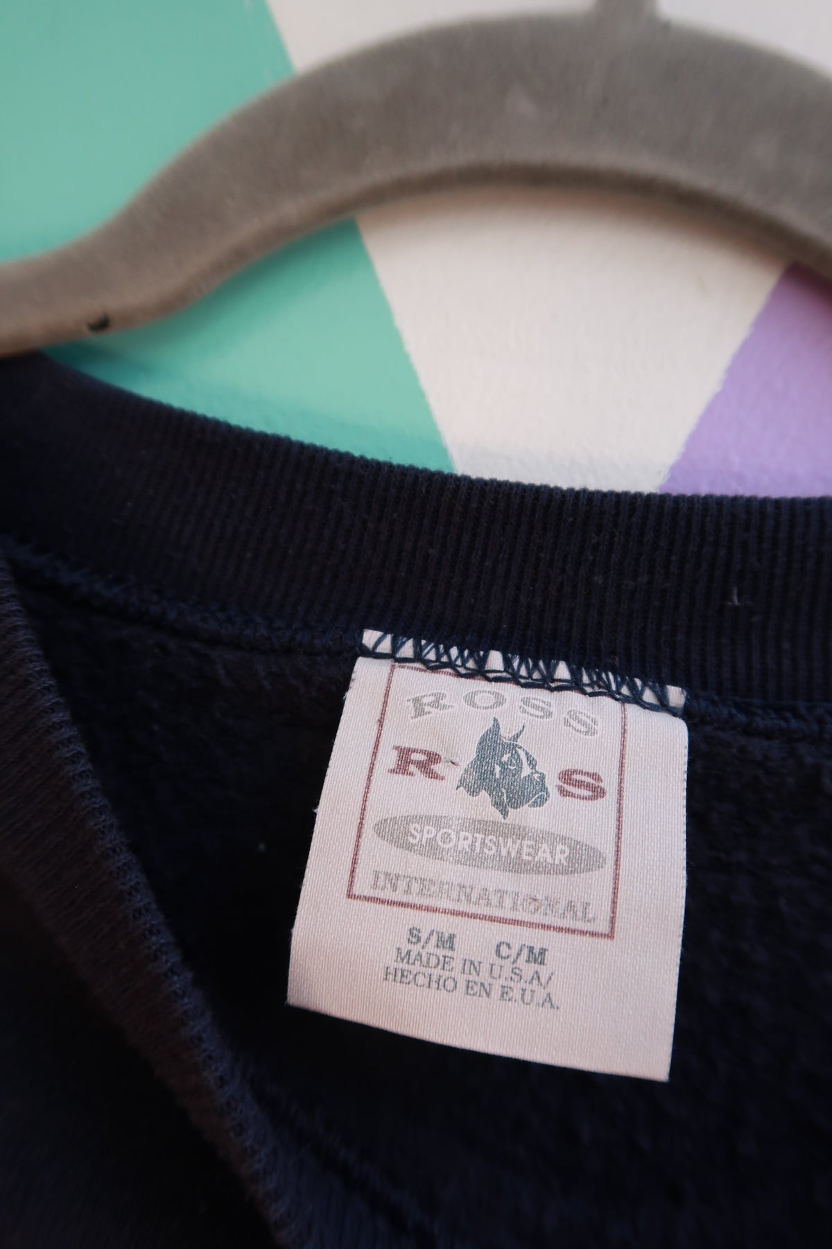Navy blue vintage 90s Elektra Vintage crewneck sweatshirt with celestial sun and moon graphic design.