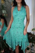 Vintage 2000s teal glittery fairycore dress by Elektra Vintage, featuring shimmering fabric and a flowing silhouette.