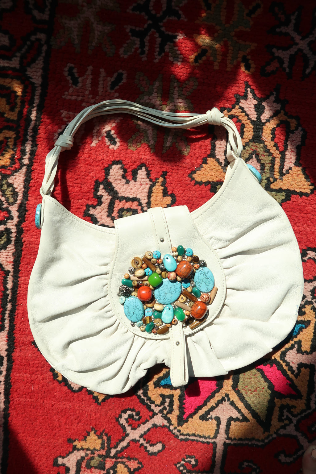 Elektra Vintage white boho hobo bag with colorful beaded turquoise embellishments and a relaxed, vintage-inspired design.