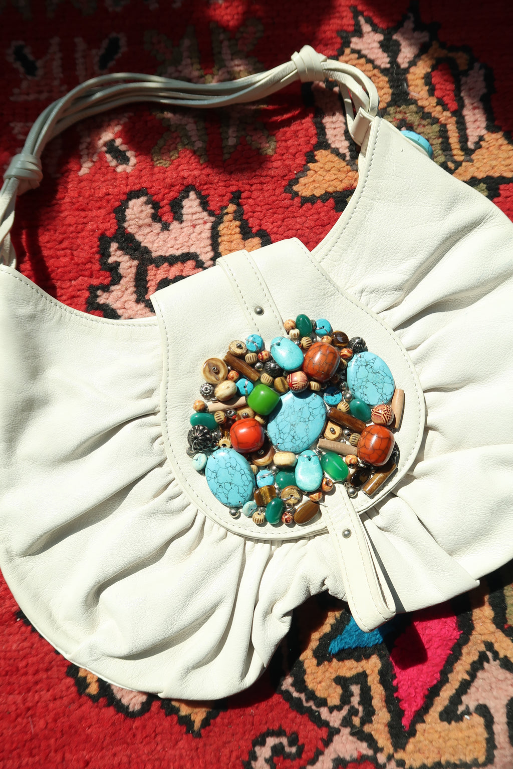 Vintage white boho hobo bag by Elektra Vintage with colorful beaded turquoise embellishments and woven strap details.