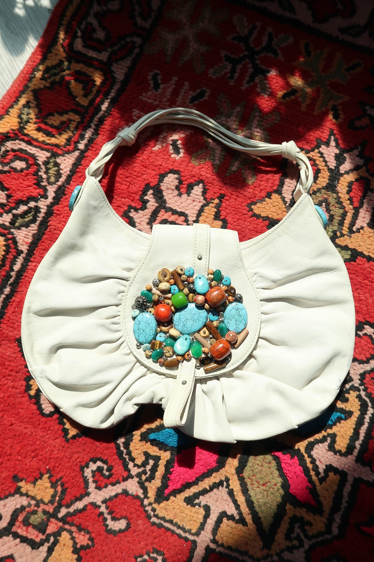 Vintage white boho hobo bag by Elektra Vintage with colorful beaded turquoise embellishments and soft leather straps.