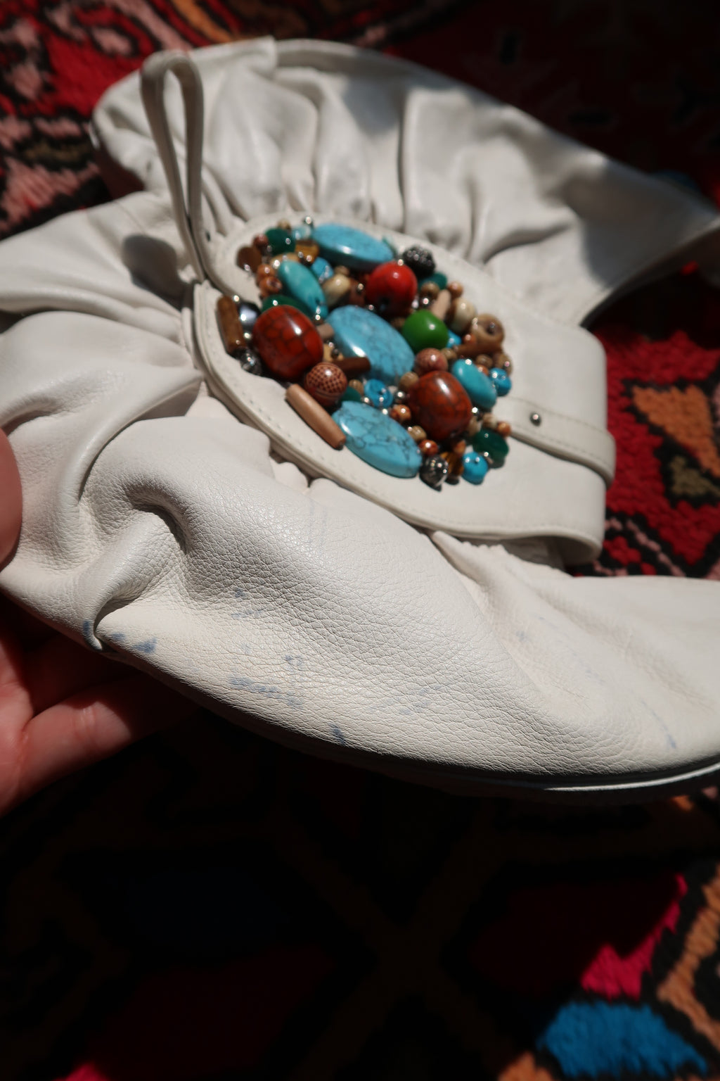 Vintage white boho hobo bag by Elektra Vintage featuring colorful beaded turquoise embellishments and a relaxed bag design.