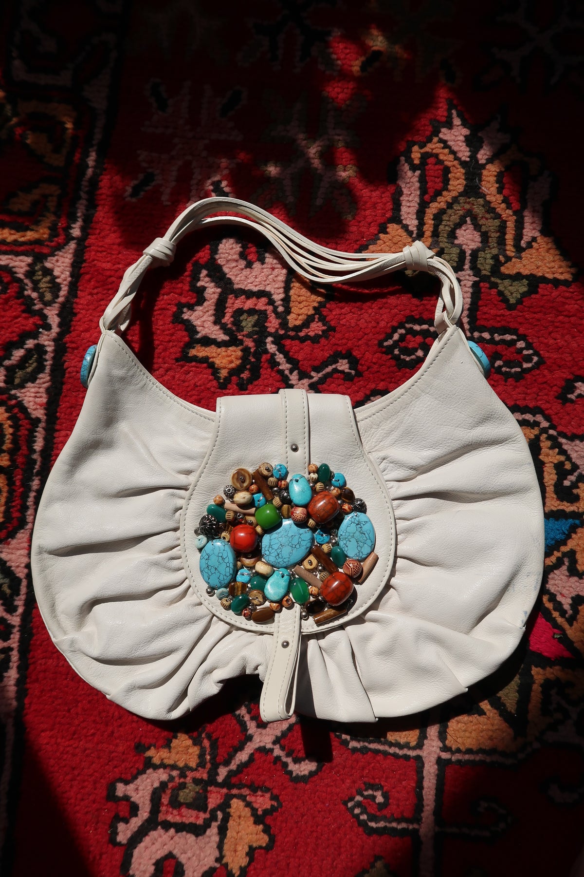 Vintage white boho hobo bag with colorful beaded turquoise embellishments by Elektra Vintage, featuring a relaxed, stylish design.