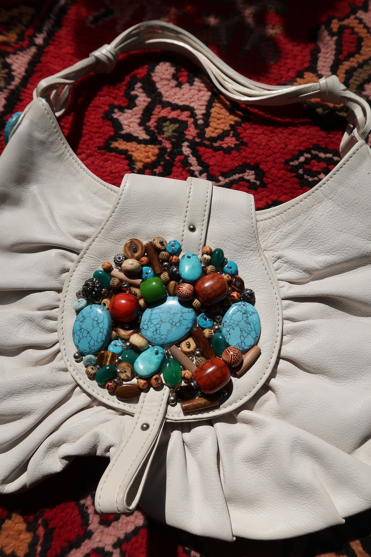 Vintage white boho hobo bag by Elektra Vintage with colorful beaded turquoise embellishments and woven strap details.