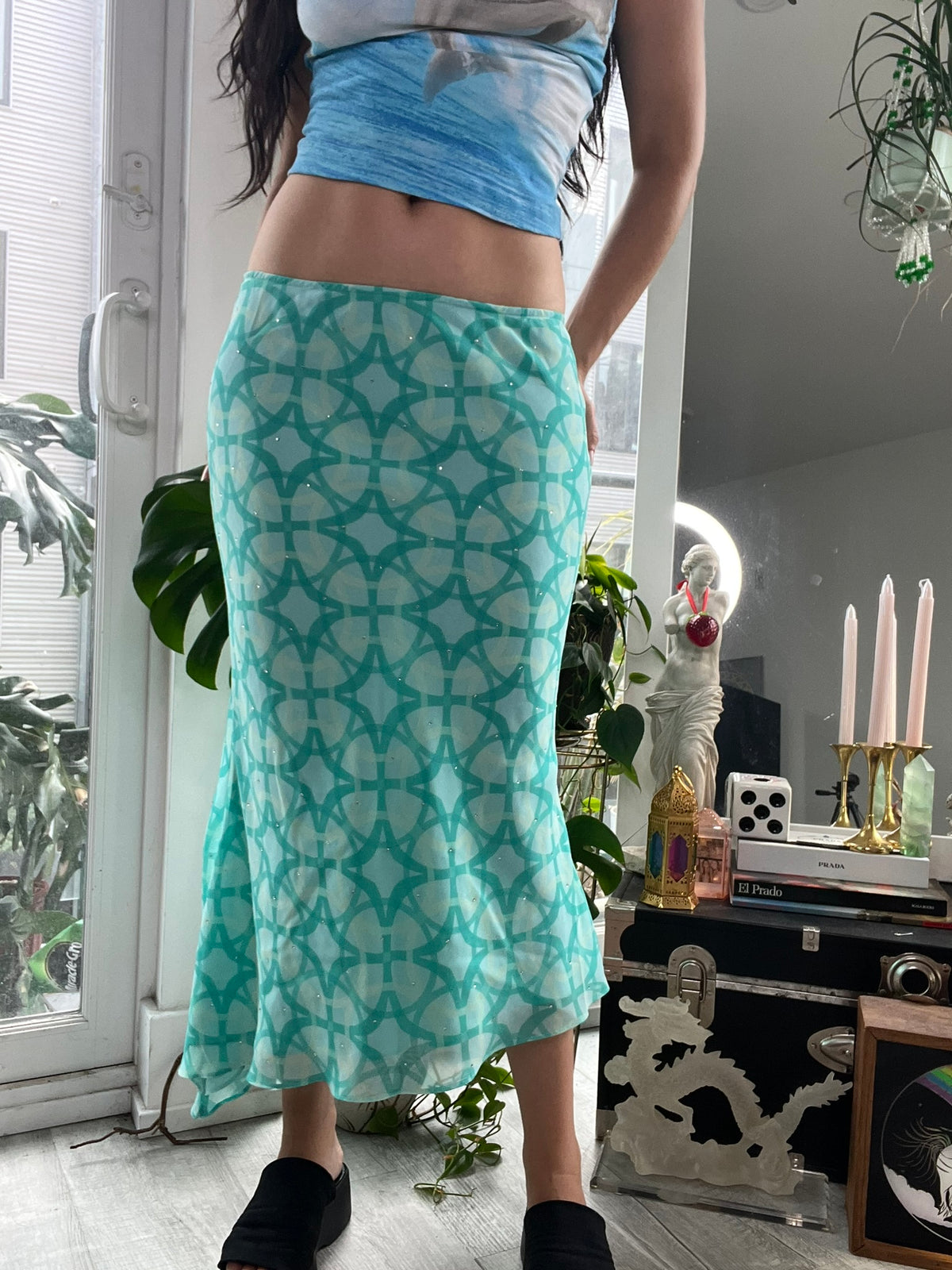 Blue geometric midi skirt with rhinestone details by Elektra Vintage, styled with a sleek, modern design perfect for stylish outfits.