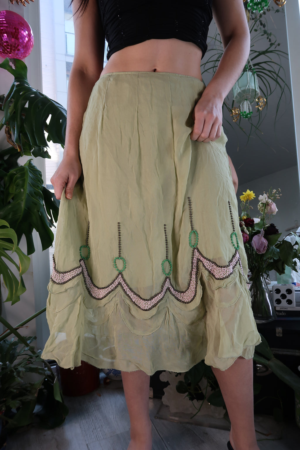 Elektra Vintage green beaded midi skirt with a flowy silhouette, featuring intricate beadwork and a stylish, bohemian design.