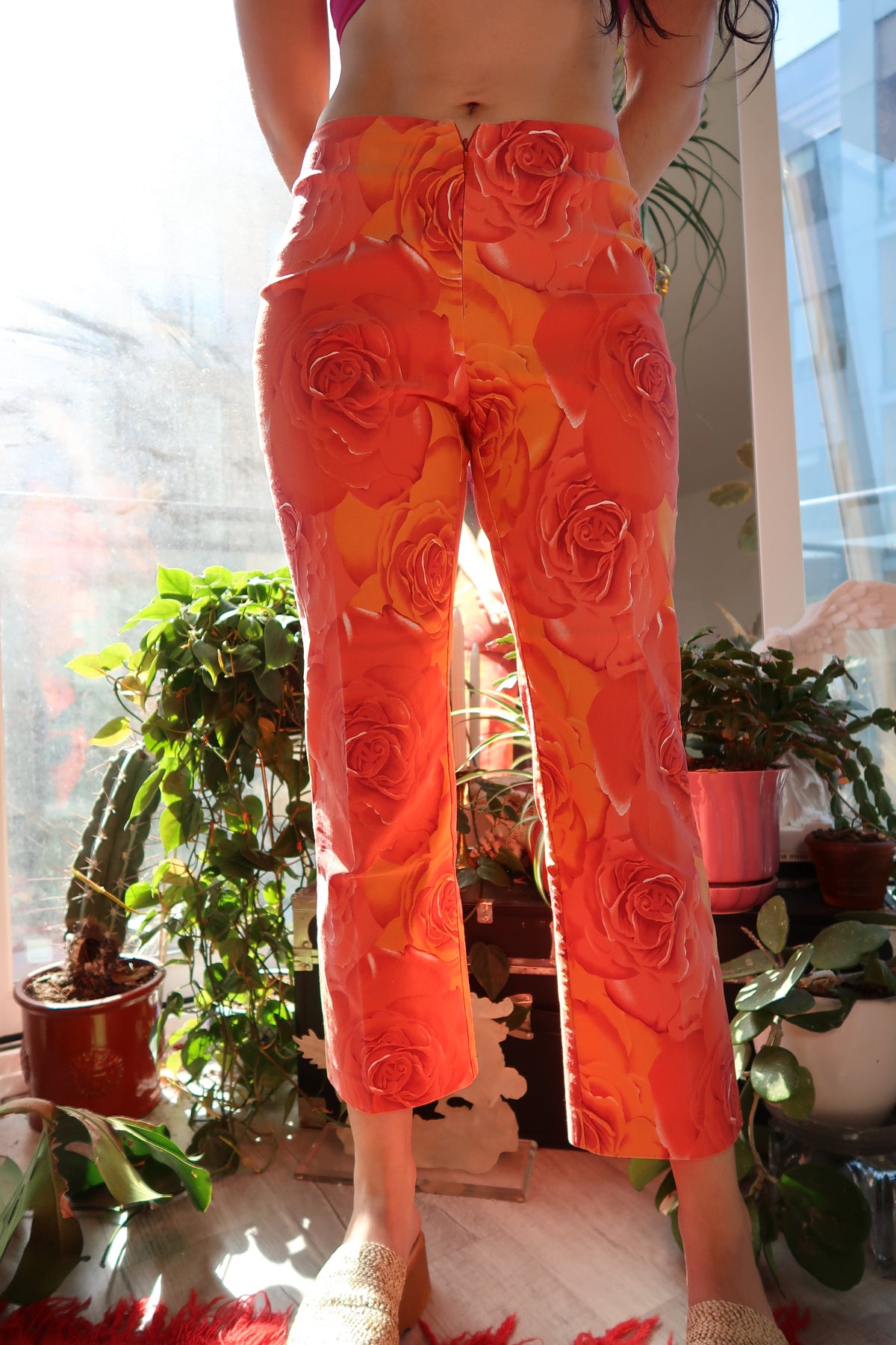 Vintage 2000s Cache orange rose patterned women's pants by Elektra Vintage, featuring a retro floral design and tailored fit.