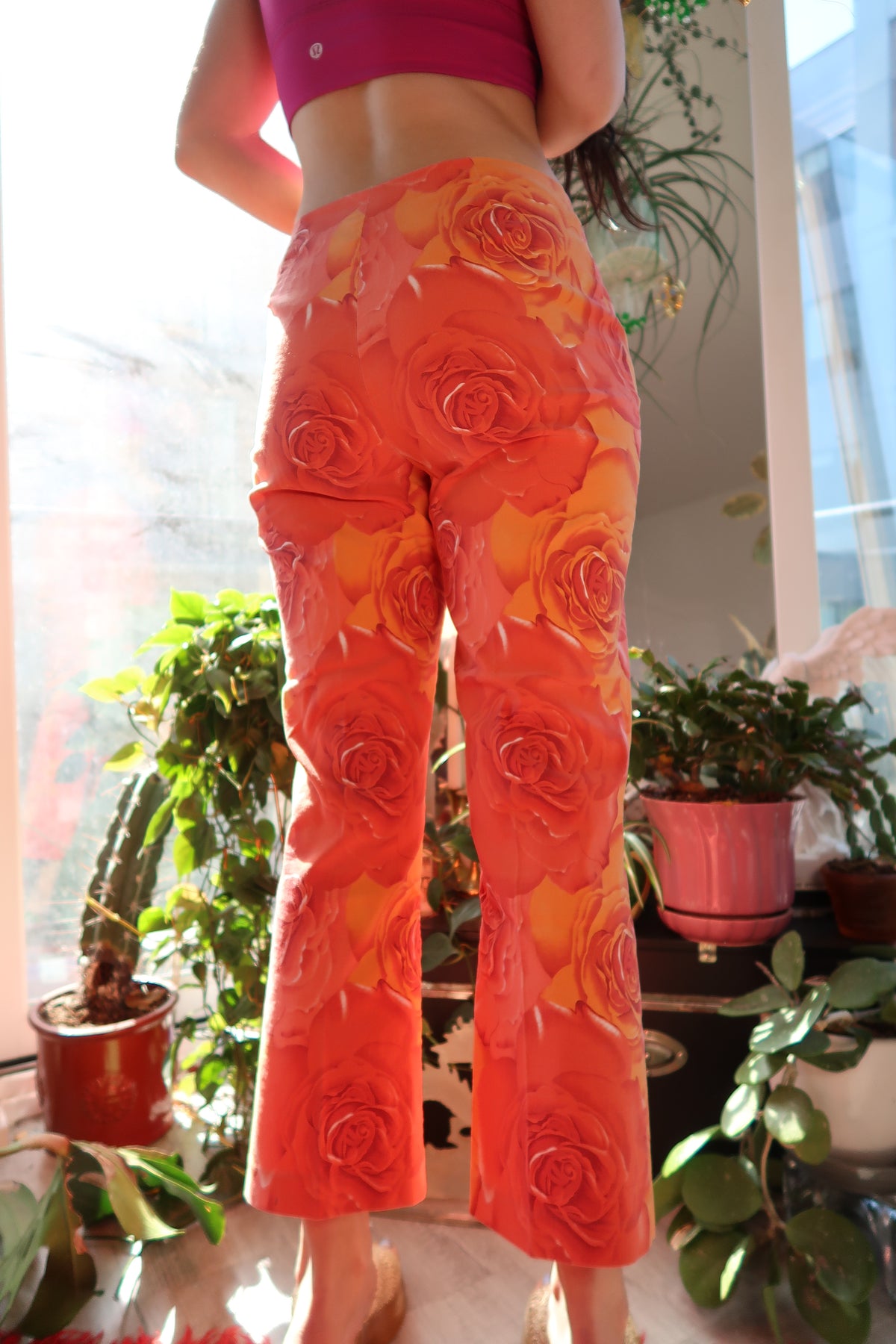 Vintage 2000s Cache orange rose patterned women's pants by Elektra Vintage, featuring a colorful floral design and classic fit.
