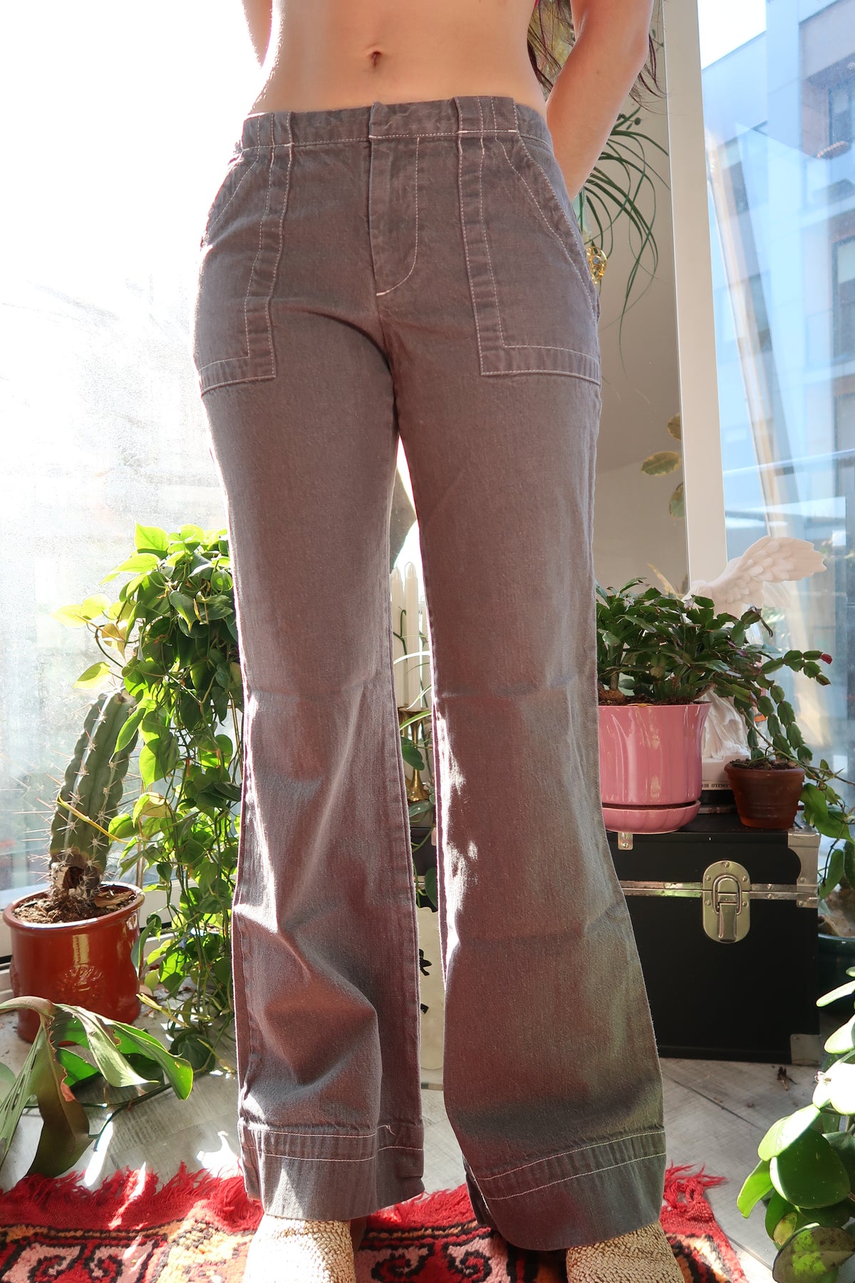 Vintage 2000s Gap grey cargo pants for women, styled with pockets and relaxed fit, displayed on a hanger.