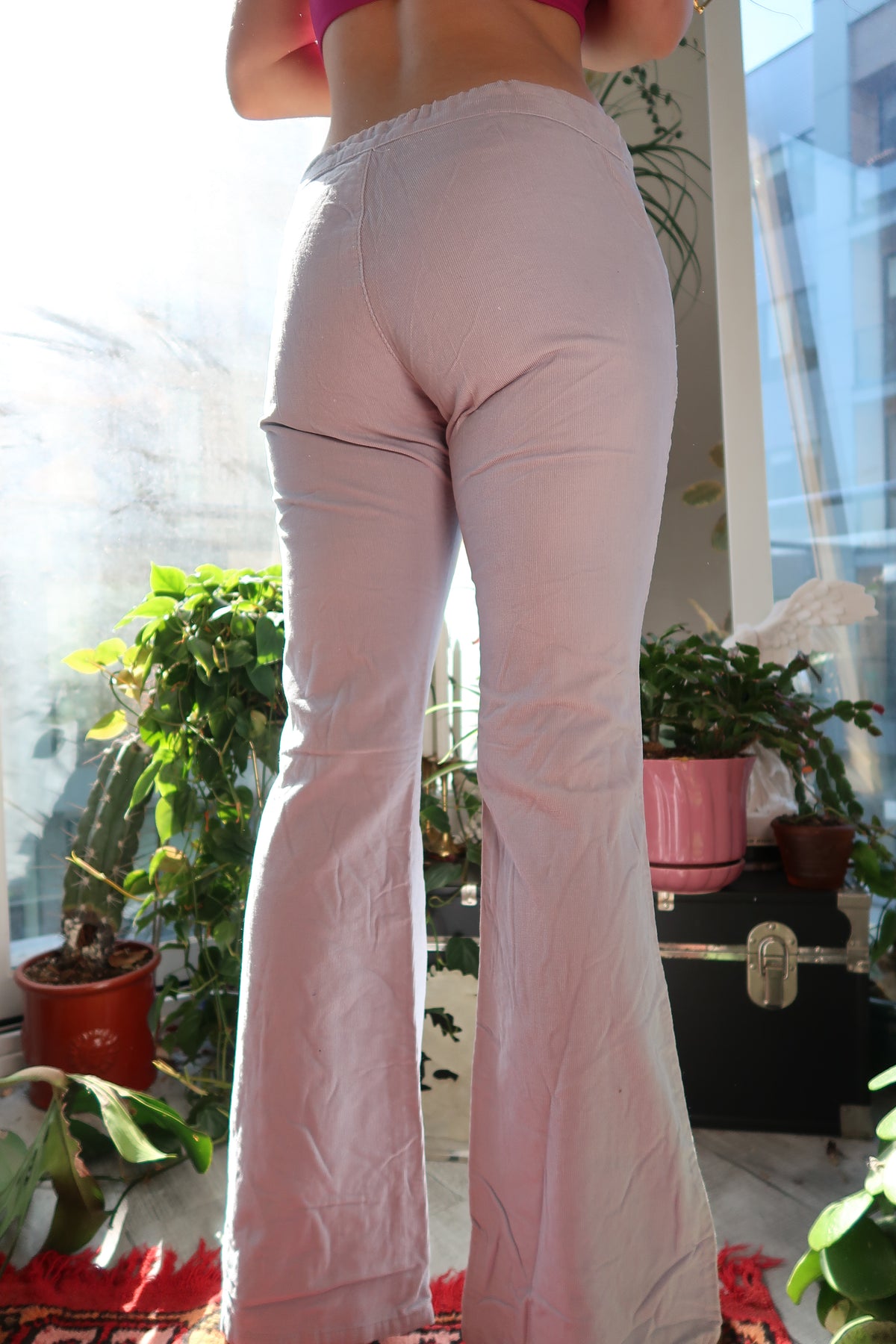 Women's vintage Elektra Vintage grey corduroy pants with a relaxed fit and classic design, shown on a model.