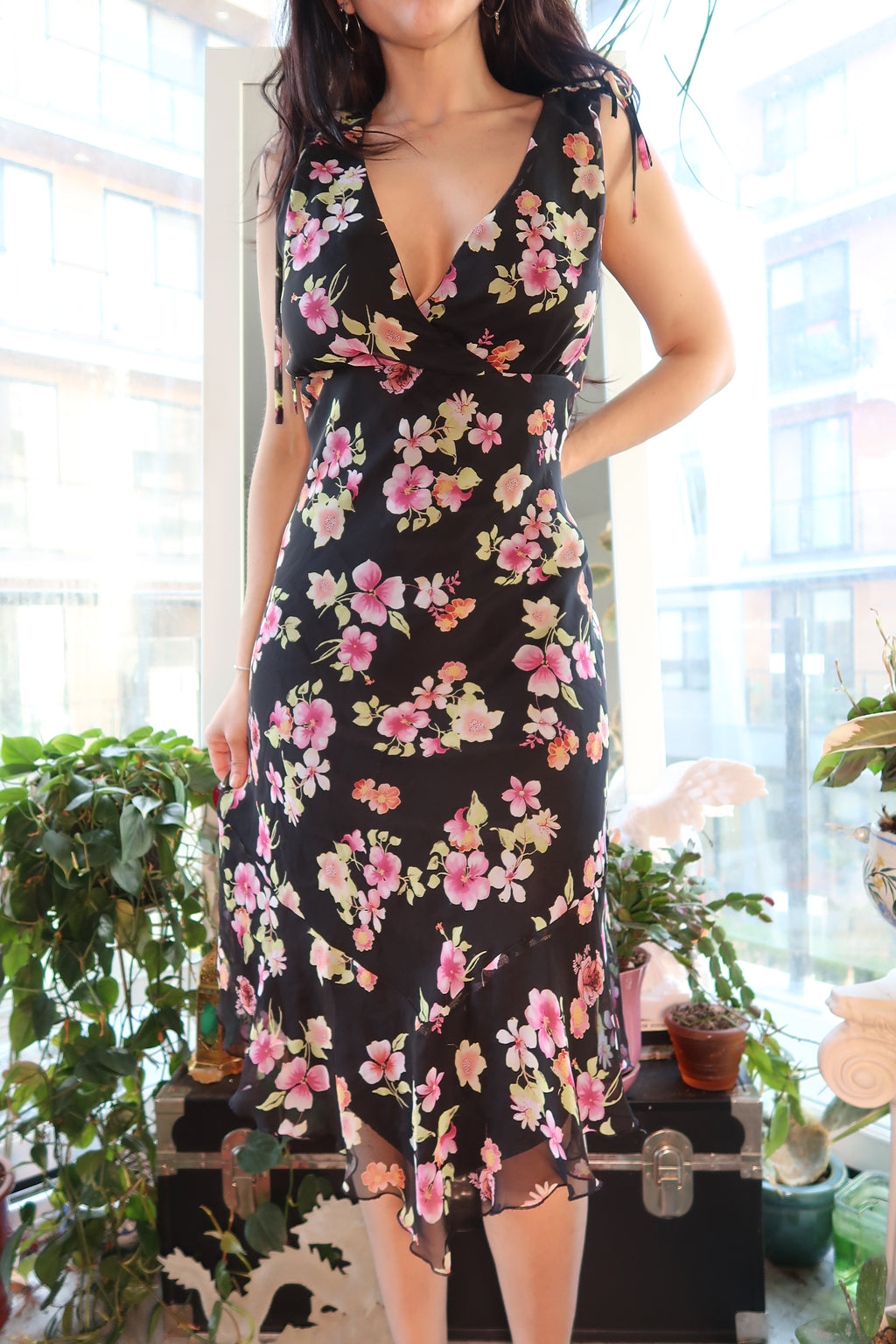 Vintage 2000s floral midi dress by Elektra Vintage, featuring a fitted waist, colorful floral pattern, and flowing midi length.