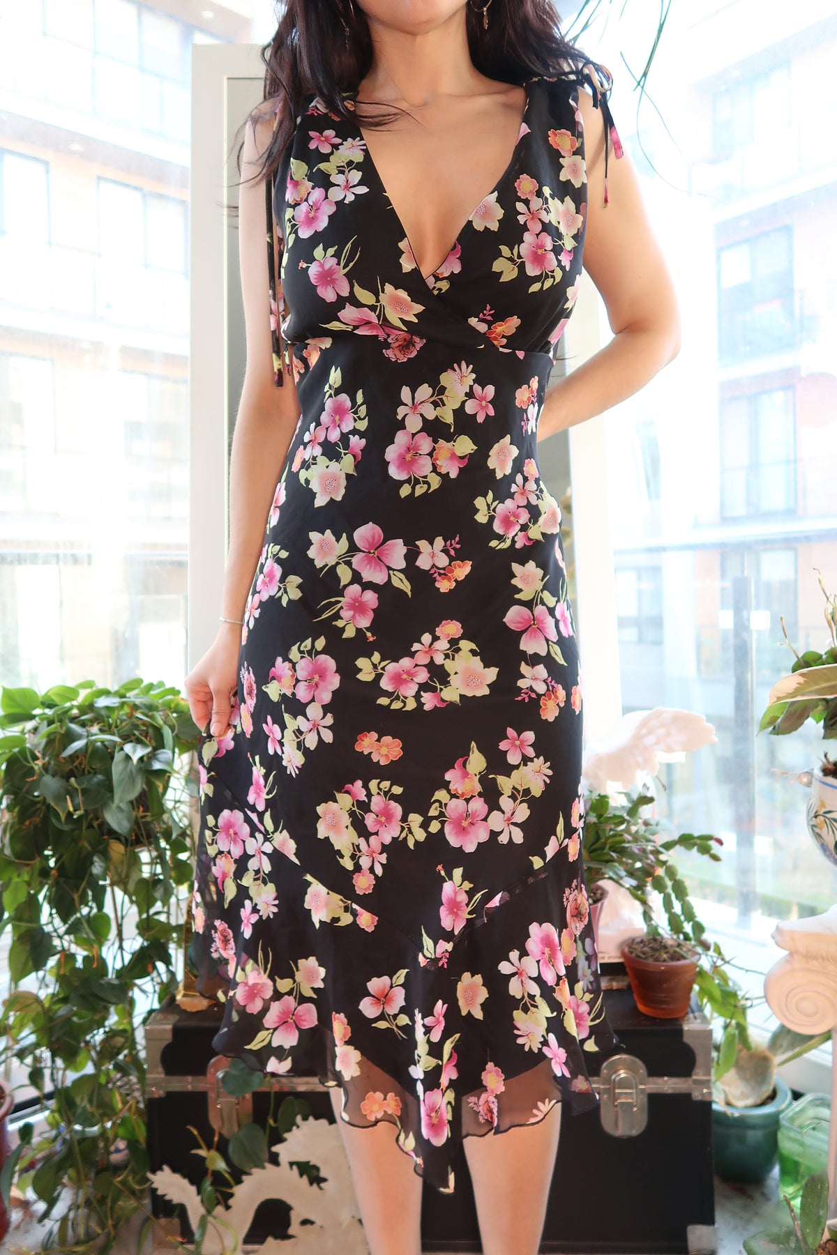 Vintage 2000s floral midi dress by Elektra Vintage, featuring a flowy fabric and vibrant flower pattern.