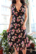 Vintage 2000s floral midi dress by Elektra Vintage, featuring a flowing fabric and vibrant floral pattern.