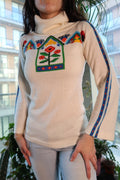 Colorful 70s knit bell sleeve turtleneck sweater for women by Elektra Vintage, showcasing vibrant yarn and retro style.