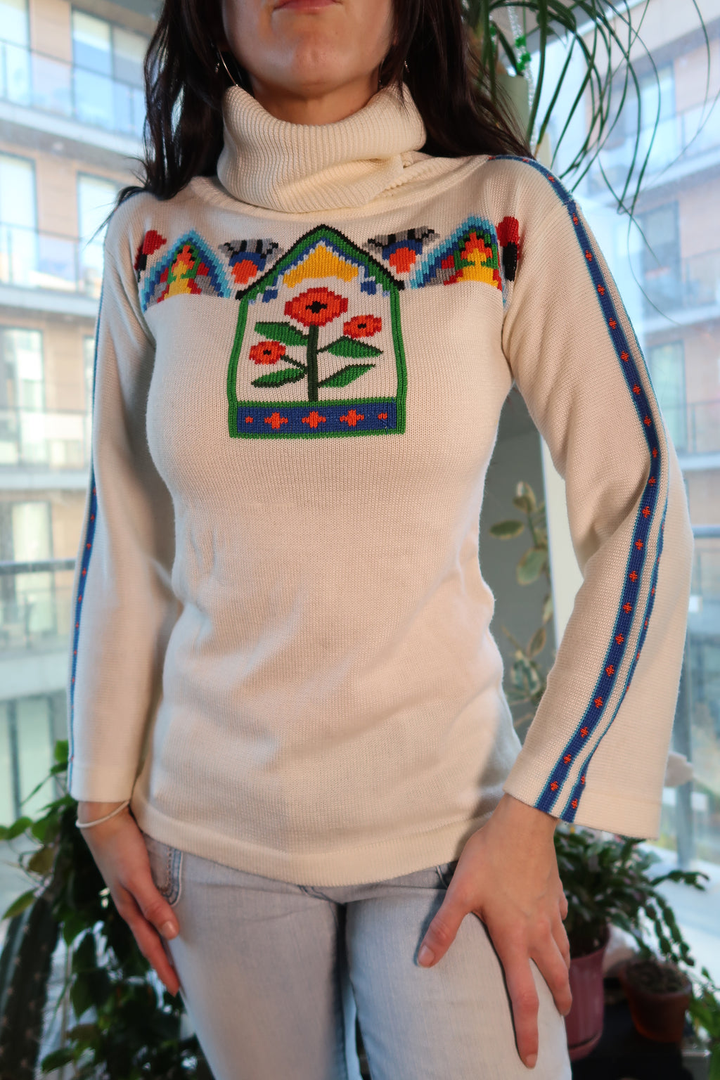 Colorful 70s knit bell sleeve turtleneck sweater for women by Elektra Vintage, featuring vibrant patterns and cozy knit fabric.