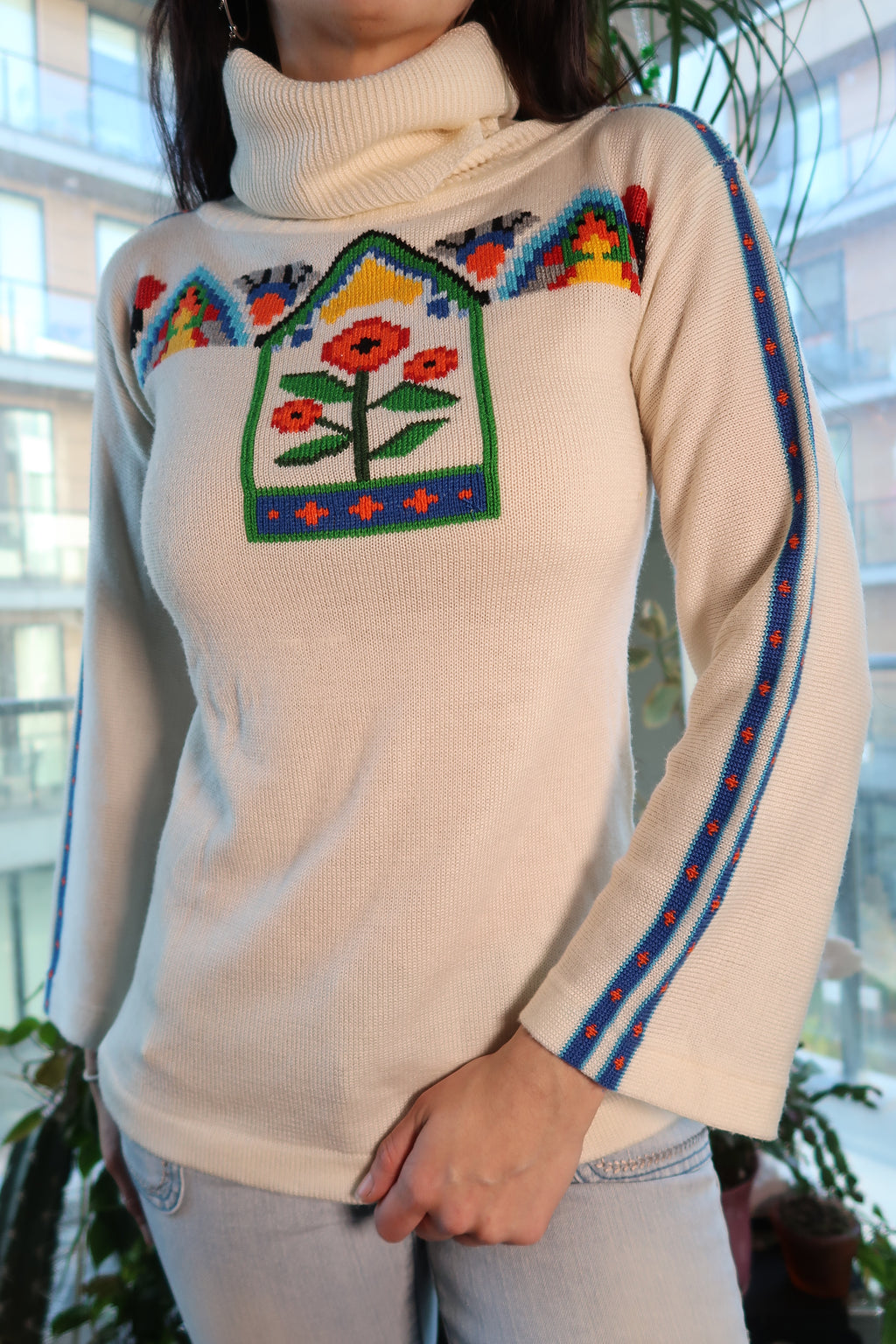 Colorful 70s knit bell sleeve turtleneck sweater for women by Elektra Vintage, featuring vibrant patterns and cozy fabric.