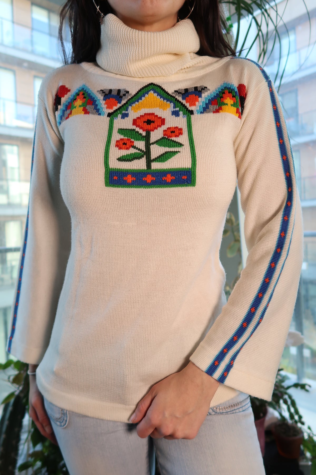 Colorful 70s knit bell sleeve turtleneck sweater for women by Elektra Vintage, featuring vibrant patterns and cozy fabric.