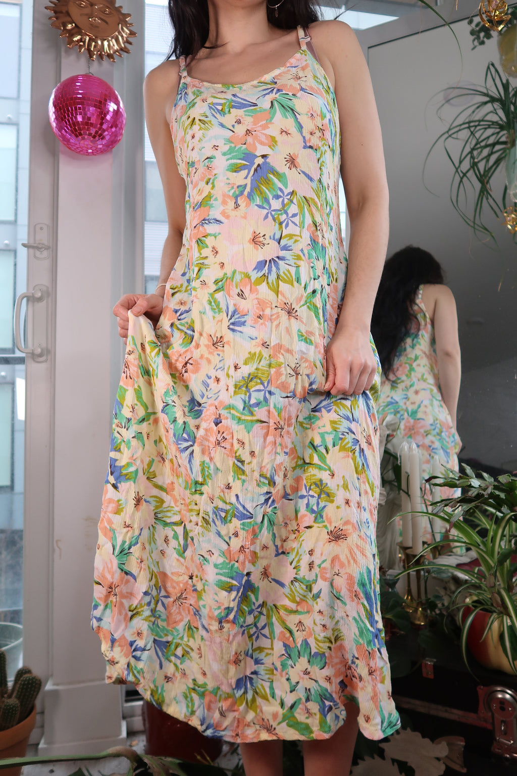 Elektra Vintage tropical floral midi dress with vibrant leaf and flower patterns, flowing fabric, and sleeveless design.