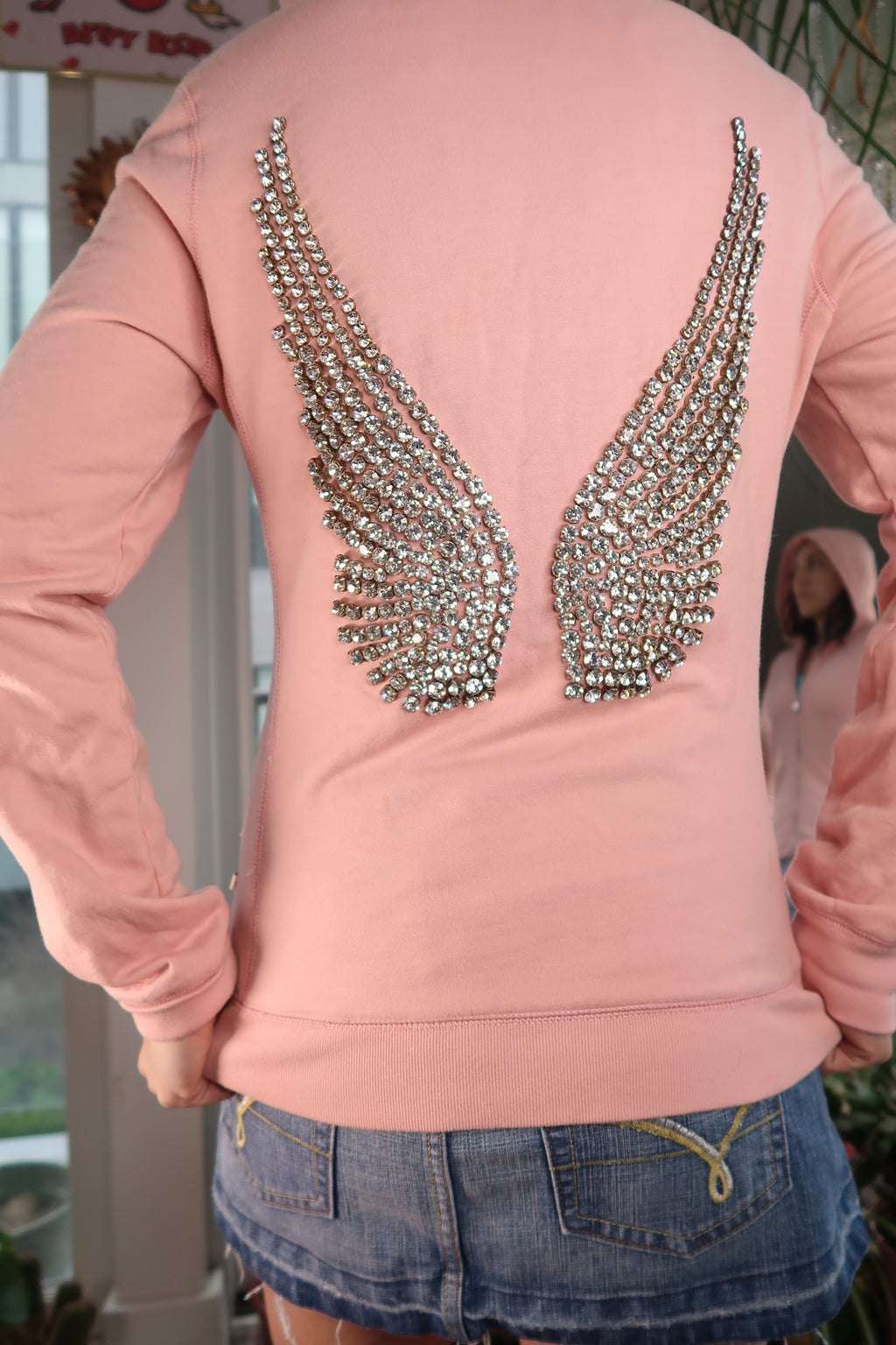 Women's 2000s rhinestone angel wings hoodie by Elektra Vintage, featuring sparkly wing design on a retro-style top.