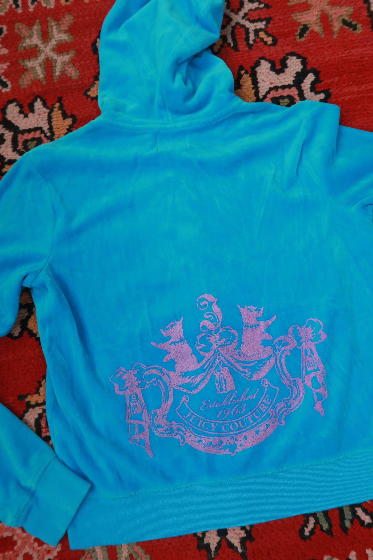 Vintage turquoise Velour zip-up hoodie for women by Juicy Couture, featuring Y2K fashion style and Elektra Vintage branding.