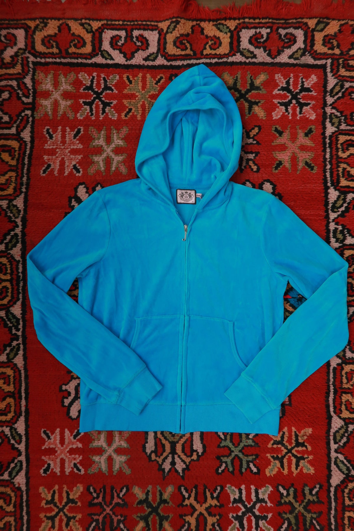 Vintage turquoise Juicy Couture velour zip-up hoodie for women from Elektra Vintage, featuring classic Y2K style.