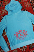 Vintage Baby Blue Juicy Couture terry cloth zip-up hoodie for women, styled with a casual fit and iconic brand details.