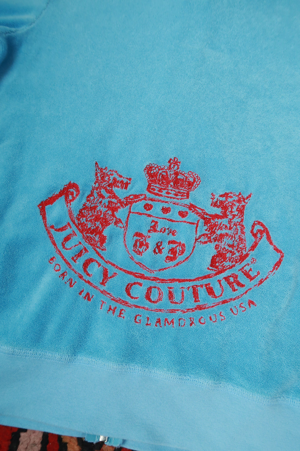 Vintage baby blue Juicy Couture terry cloth zip-up hoodie for women, branded Elektra Vintage, with a casual, cozy fit.