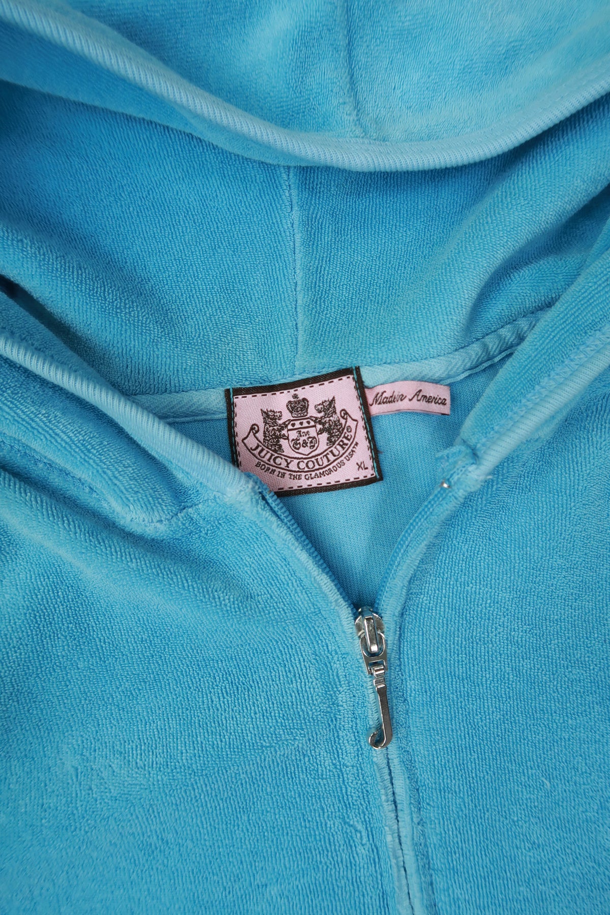 Vintage Baby Blue Juicy Couture Terry Cloth Zip-Up Hoodie for women, styled with a front zipper and casual fit.
