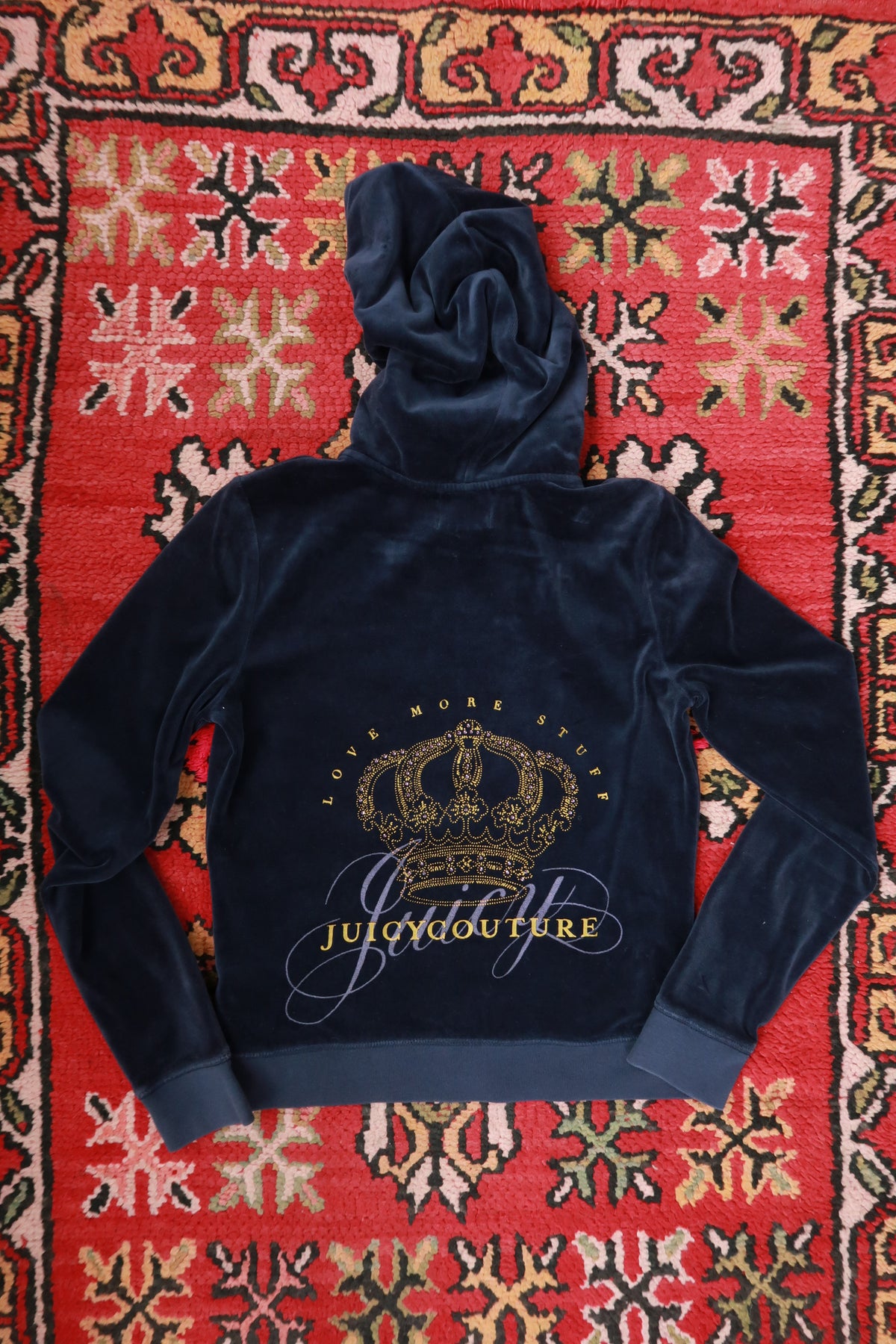 Women's vintage navy velour zip-up hoodie by Juicy Couture, featuring a Y2K style from Elektra Vintage.