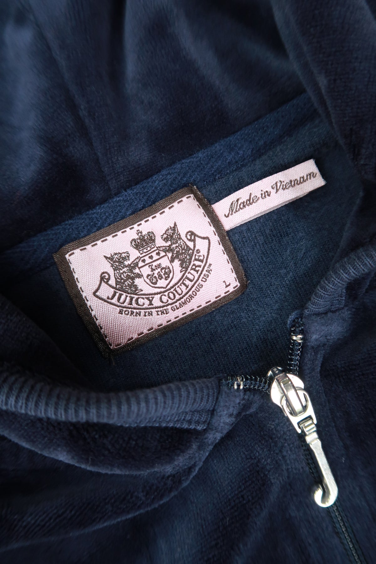 Vintage navy Juicy Couture velour zip-up hoodie for women, stylish Y2K-inspired top by Elektra Vintage.