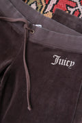Chocolate brown Juicy Couture velour lounge pants for women by Elektra Vintage, featuring a relaxed fit and soft velour fabric.