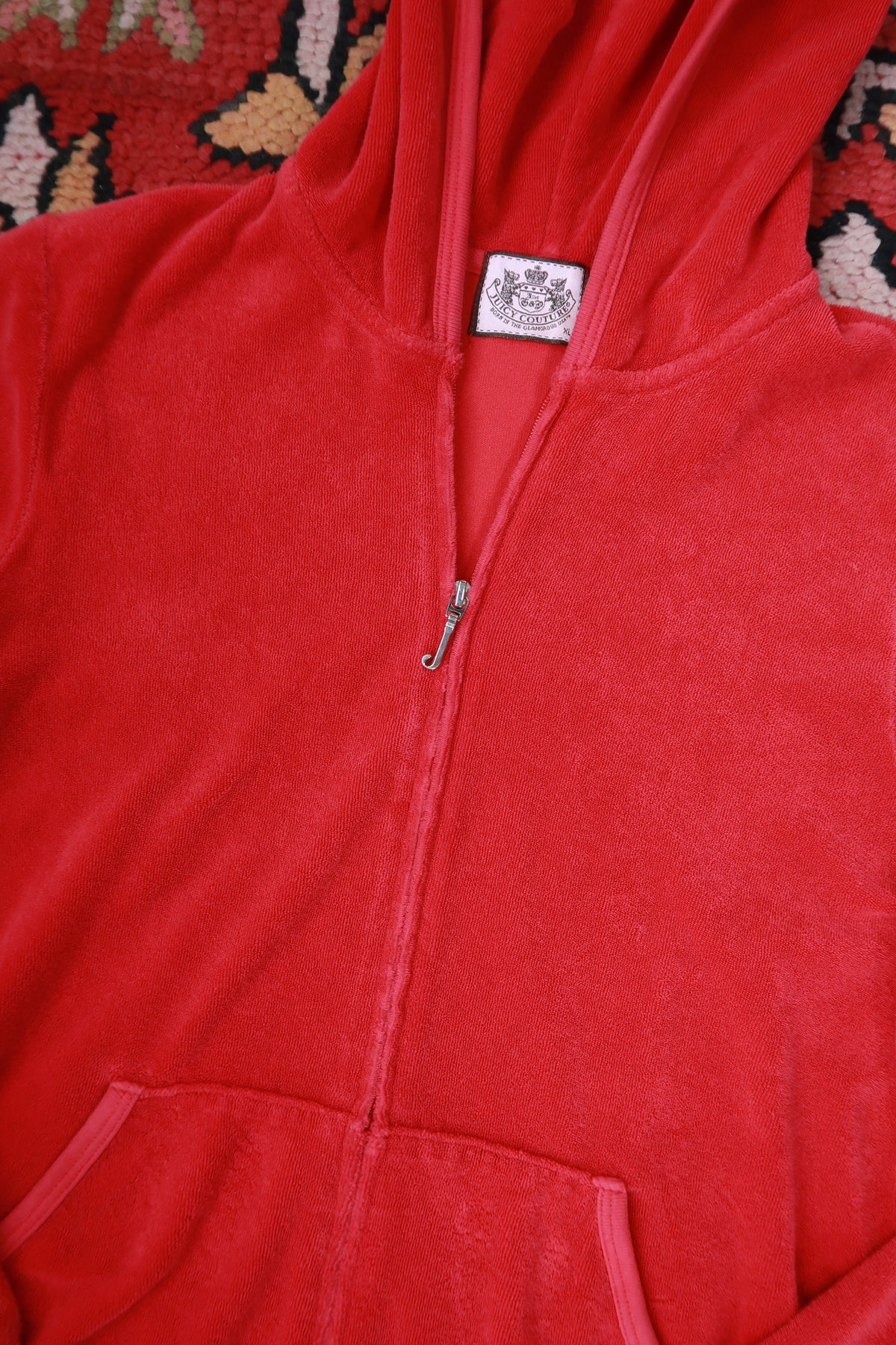 Vintage Y2K Juicy Couture cherry red terry cloth zip-up hoodie for women, styled with a relaxed fit and signature logo details.
