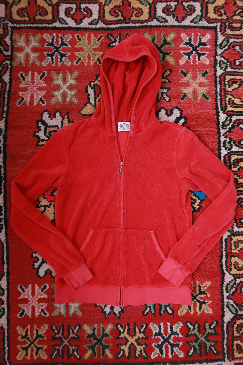 Vintage Juicy Couture cherry red terry cloth zip-up hoodie for women, styled with a casual, retro Y2K vibe from Elektra Vintage.