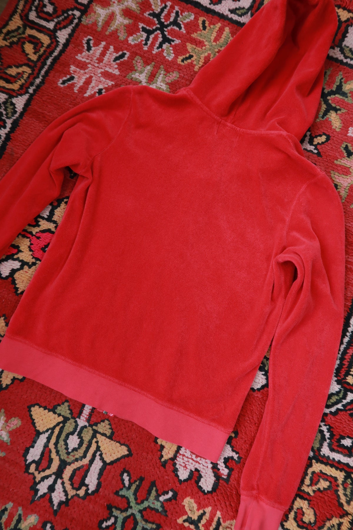 Vintage Y2K Cherry Red Juicy Couture terry cloth zip-up hoodie for women, from Elektra Vintage, featuring a casual, retro style.
