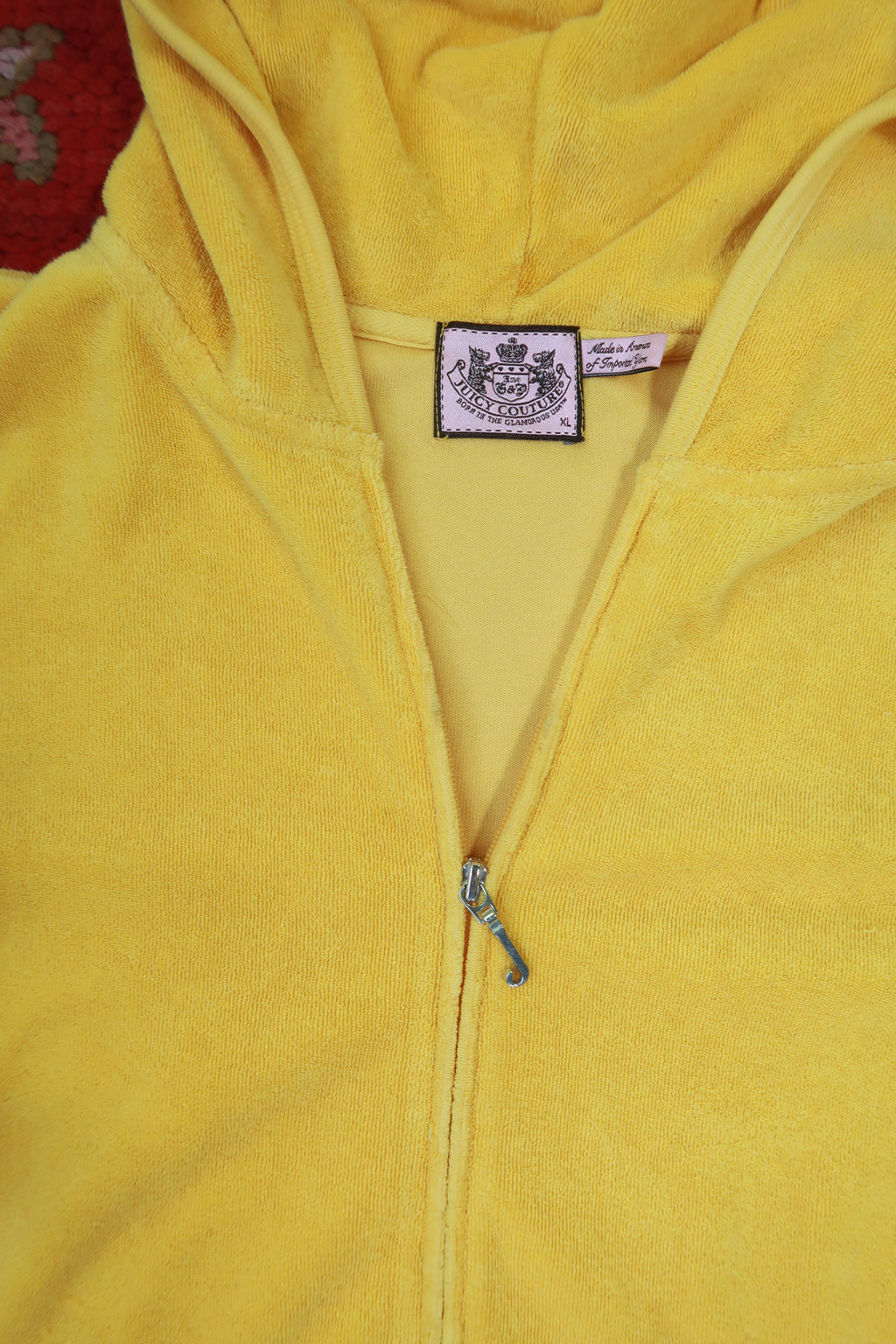 Vintage yellow Juicy Couture terry cloth zip-up hoodie from Elektra Vintage, featuring a retro Y2K style and casual fit.