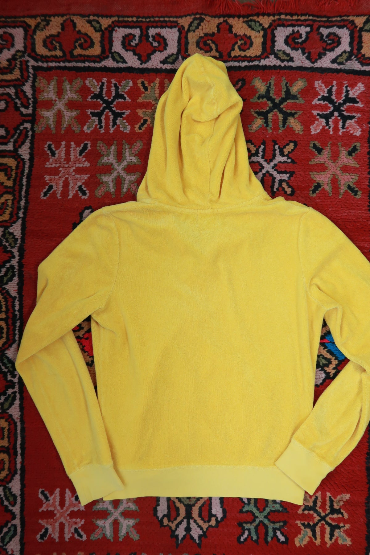 Yellow Juicy Couture terry cloth zip-up hoodie by Elektra Vintage, featuring vintage Y2K style and casual, cozy fabric.