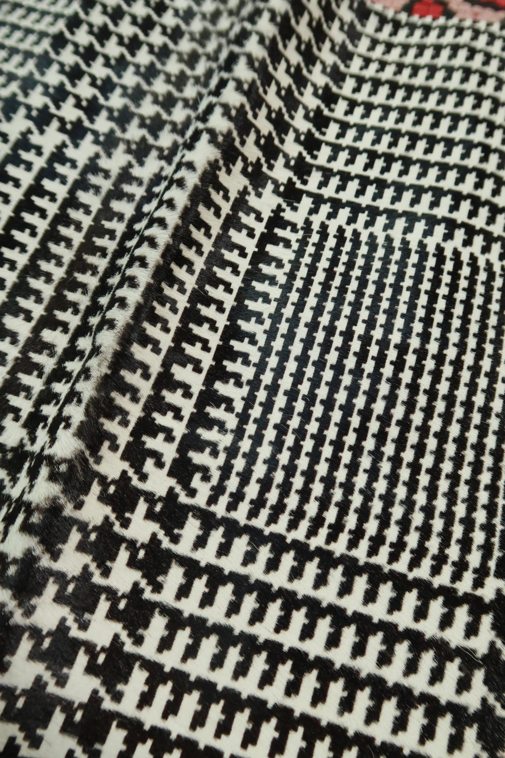 Elektra Vintage Theory black and white pony hair houndstooth mini skirt showcasing classic houndstooth pattern and fitted silhouette.