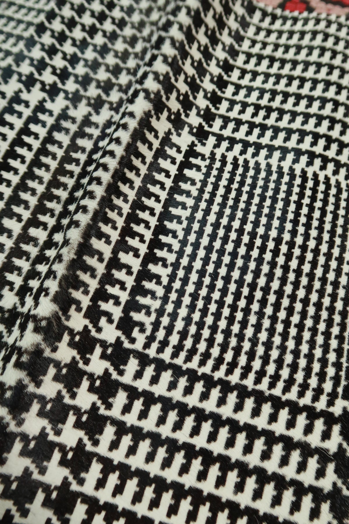 Elektra Vintage Theory black and white pony hair houndstooth mini skirt showcasing classic houndstooth pattern and fitted silhouette.