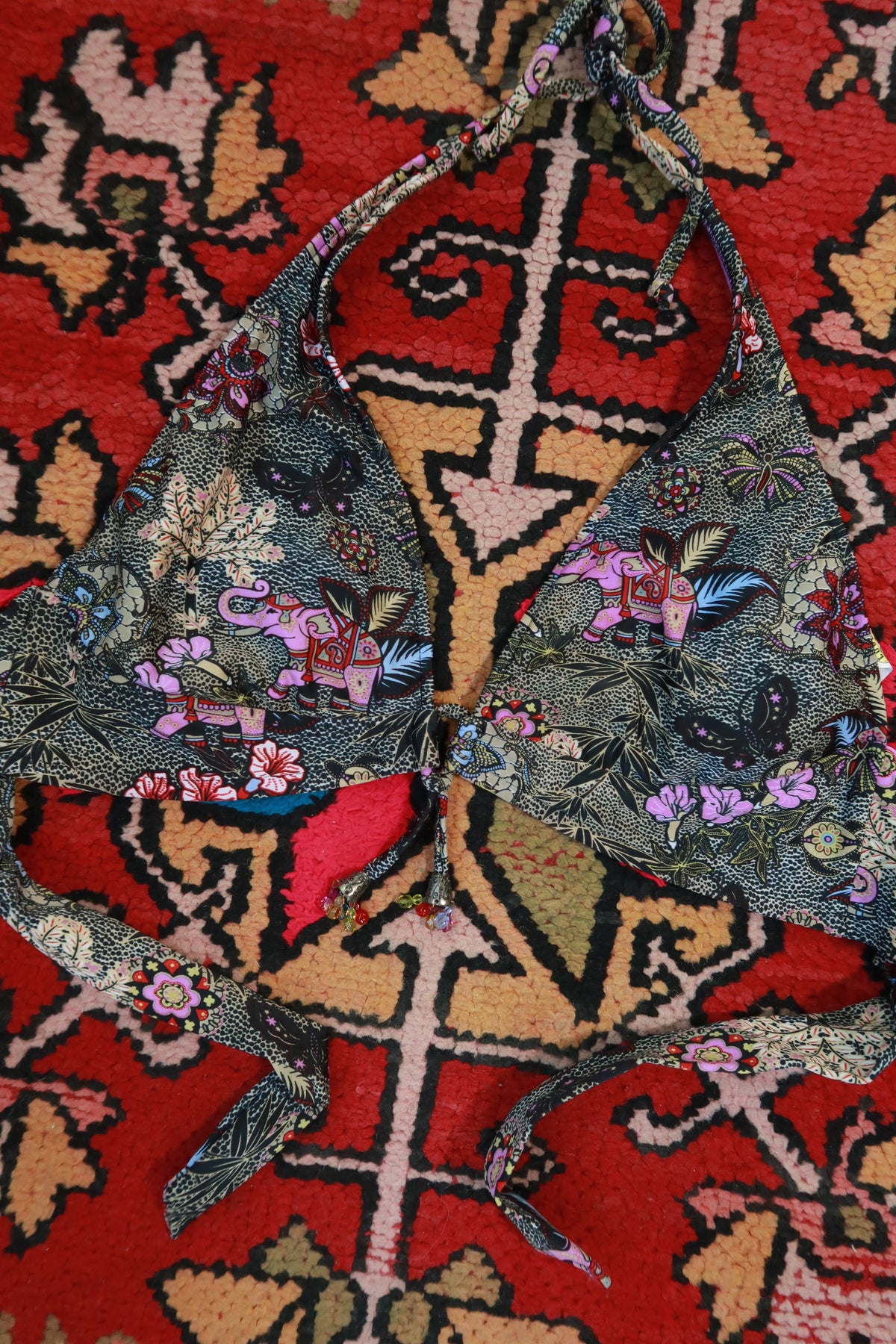 Vintage 2000s Lucky Brand tropical elephant halter bikini top for women, featuring vibrant floral print and adjustable straps.